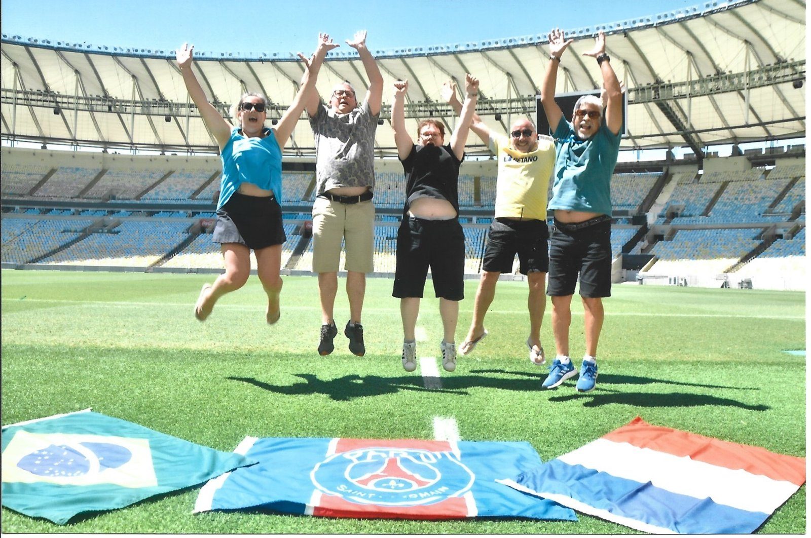 Travellers jumping for joy on the Maracanã pitch during a private stadium visit